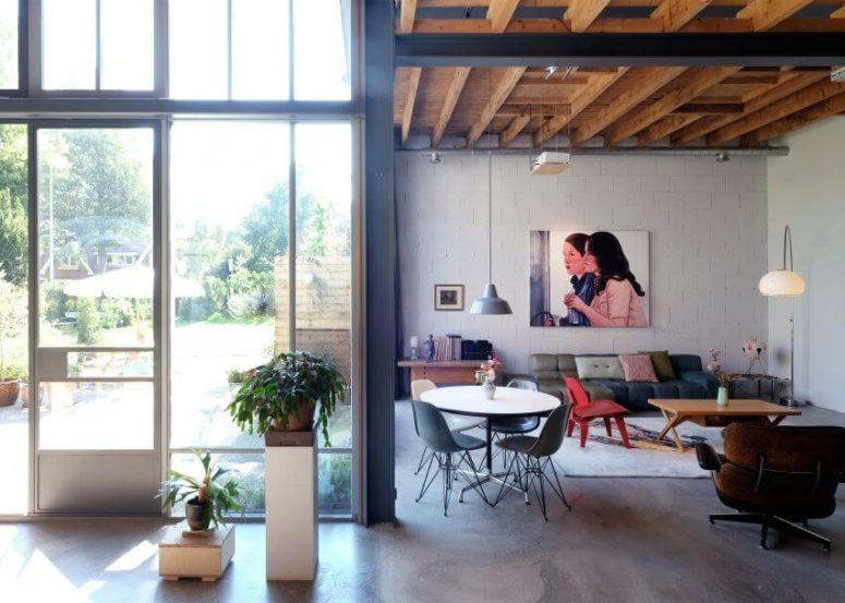 This industrial loft is located inside a couple of old barns renovated and transformed into edgy modern spaces