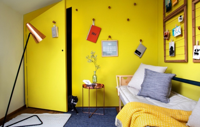 This small attic space was turned into a guest room and laundry and was decorated in sunny yellow for a cool ambience