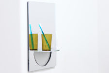 01 U Mirror features a functional shelf that can be folded when not needed