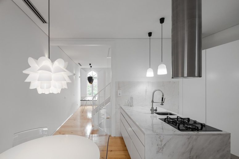 White color is methodically repeated on walls, ceilings, carpentry and marble to make the interiors modern and spacious