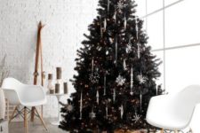 02 a black Christmas tree with white icicle and snowflake ornaments