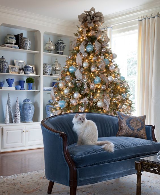 a blue, white and pearl Christmas tree decor looks very delicate