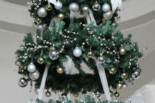 02 a chandelier made of faux evergreen wreaths and silver and gold ornaments