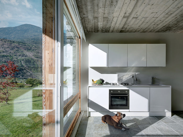 The interiors are modern, almost minimalist with rustic touches and they center around the views like this kitchen