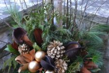 03 a chic brown and gold Christmas urn with leaves, ornaments and gilded pinecones