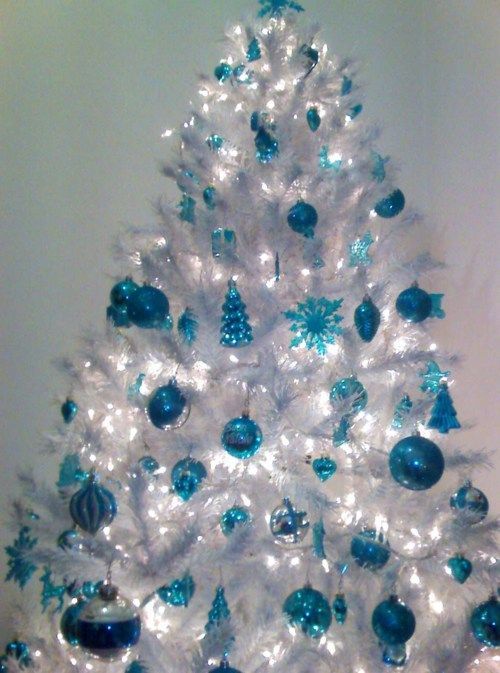 a crispy white Christmas tree with blue ornaments
