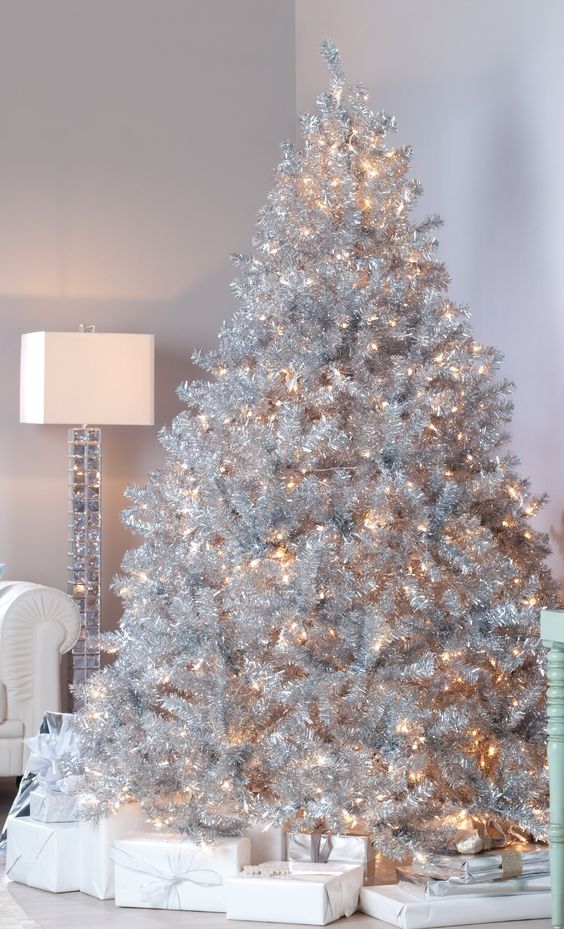 a large silver tree with lights will flatter a neutral or a pastel space fitting the look