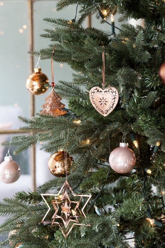 copper and rose gold ornaments for decorating a Christmas tree