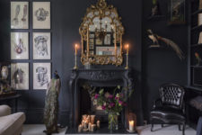 03 the antique fireplace is a focal point with candles and a refined gilded frame mirror