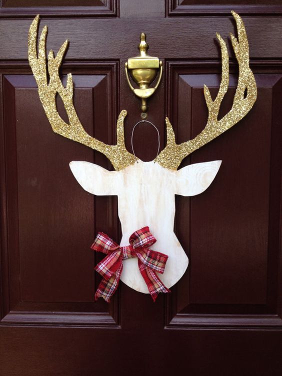 deer silhouette door hanger with glitter antlers and a plaid bow