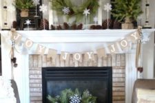04 organic decorated mantel with pinecones, evergreens and burlap is ideal if you want something rustic