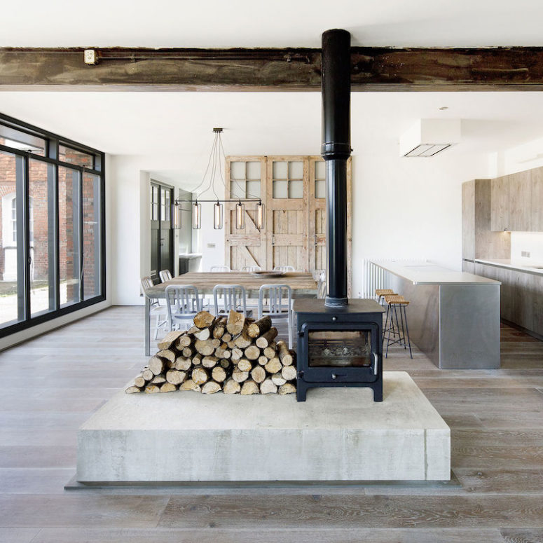 A hearth in the center divides the space into zones