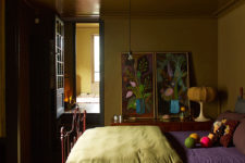 05 The master bedroom is done in ocher and spruced up with bold artworks from the owners’ collection