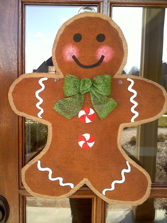 burlap gingerbread hanger with a glitter bow screams Christmas