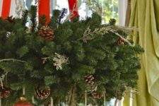 06 lush evergreen wreath with red ribbon and red and gold ornaments