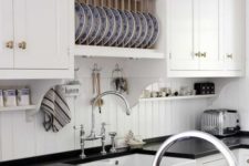 06 simple white beadboard backsplash contrasts with a black countertop