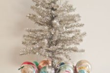 06 vintage Christmas display with colorful ornaments and a tinsel tree