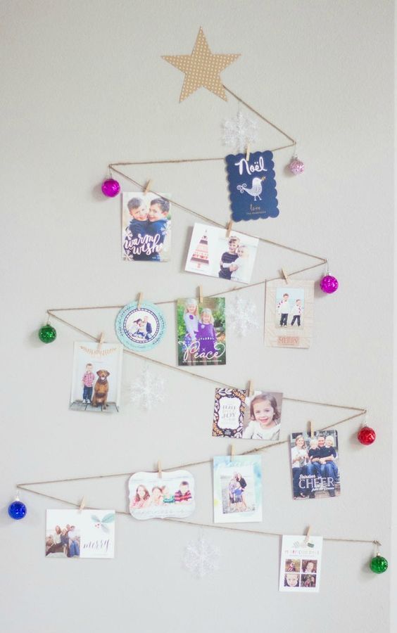 zigzag shaped Christmas tree with ornaments and photos
