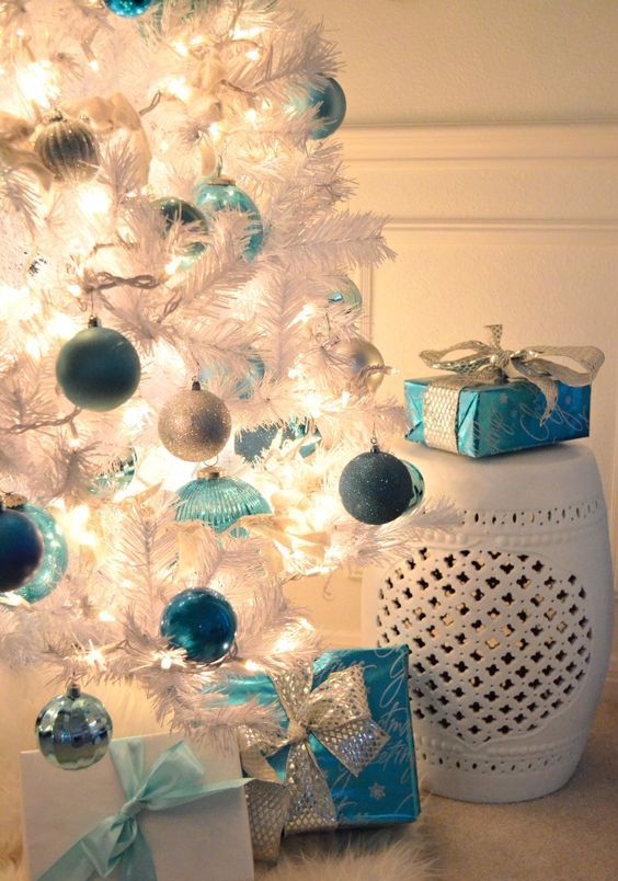 blue, light blue, silver ornaments on a white Christmas tree