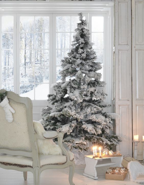 flocked tree with no decor is ideal for a white or neutral interior