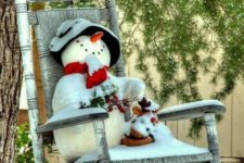 07 place a toy snowman on your front porch or in the garden