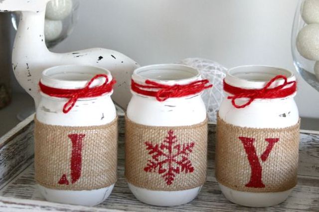 red and white mason jar candle lanterns with printed burlap