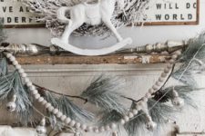 07 shabby chic mantel in off-white, a snowy wreath, garland and logs