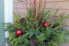 07 winter container with fresh evergreens, red branches and ornaments
