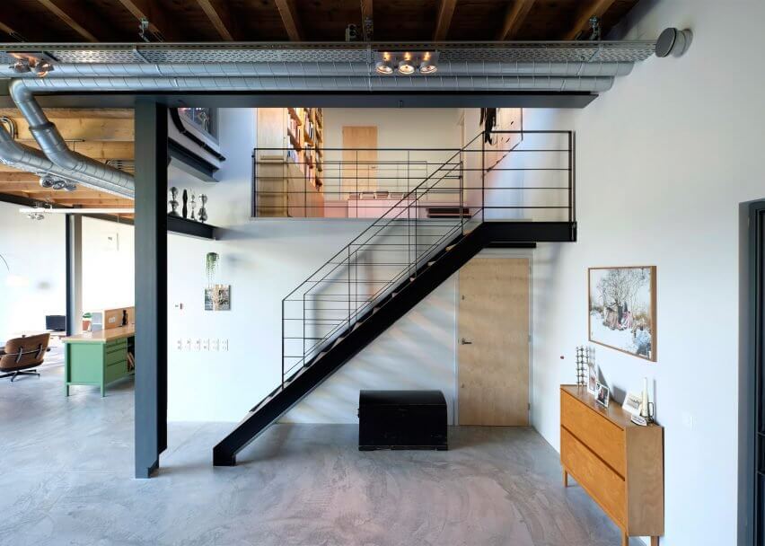 The stairs are industrial, and there are a lot of exposed pipes everywhere that bring that edgy industrial touch