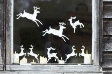 08 cut out reindeer from paper and attach them to the window creating your own look