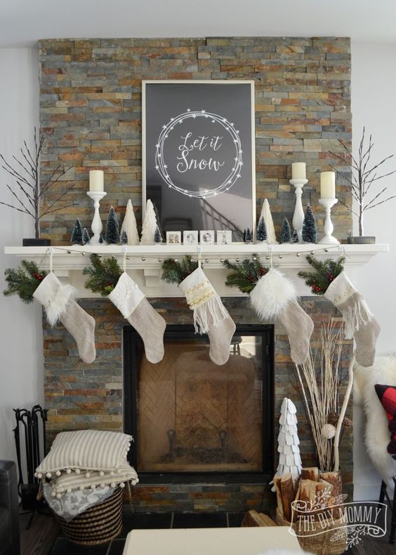 neutral stockings with evergreens, small trees and fluffy pillows