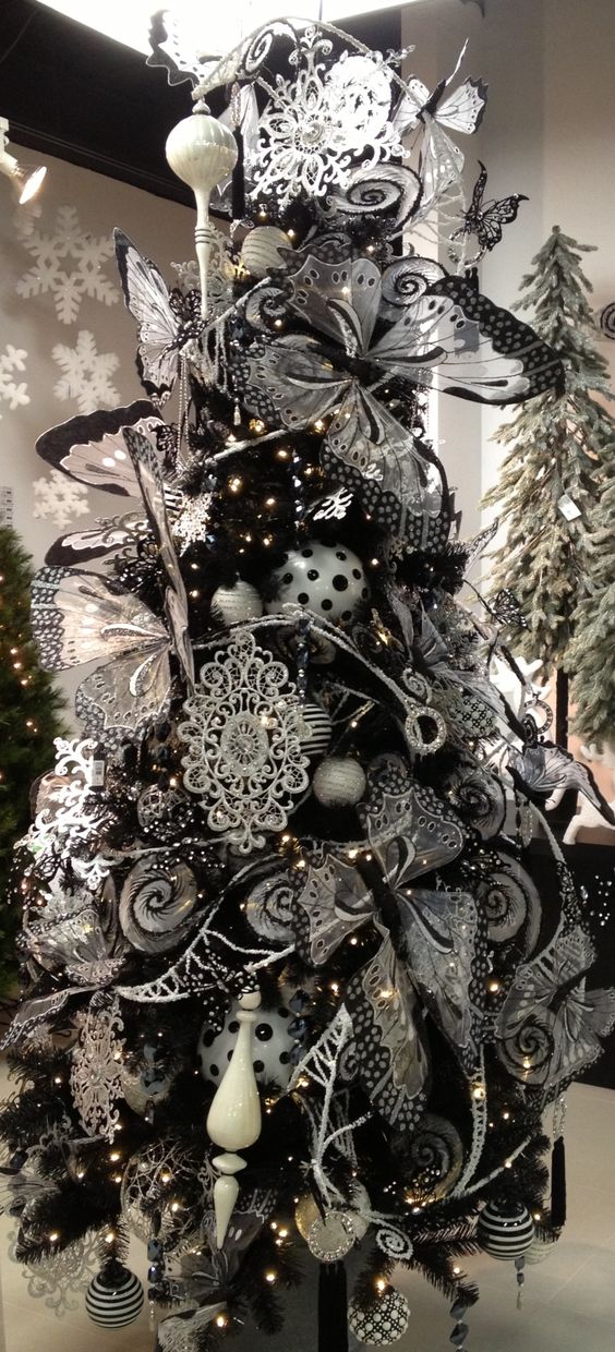 the whole tree heavily covered with romantic black and white ornaments