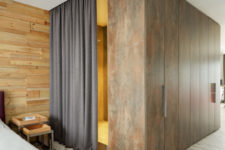 09 Look at these aged metal panels that clad the bathroom, they make a bold statement