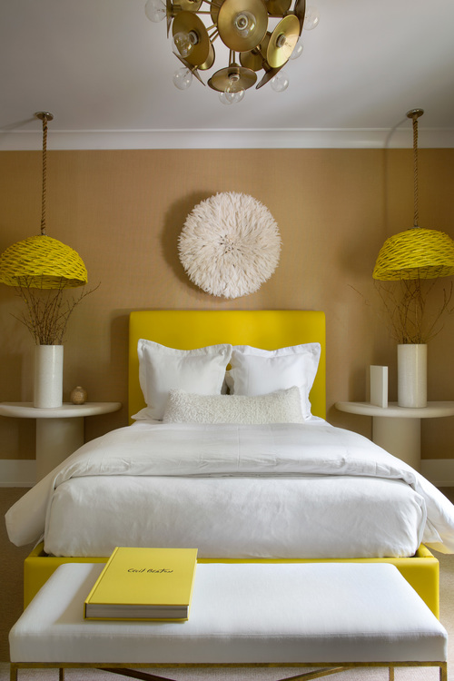 The guest bedroom is popping with yellow color, the room is neutral, though these sunny yellow touches cheer it up