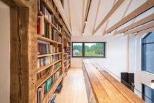 09 There’s a library area on the upper floor, with large bookcases and a simple wooden bench