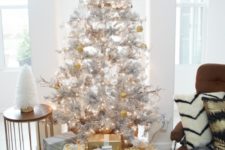 09 metallic decor ideas –  a silver tree with gold and white ornaments and gift boxes wrapped with gold and silver