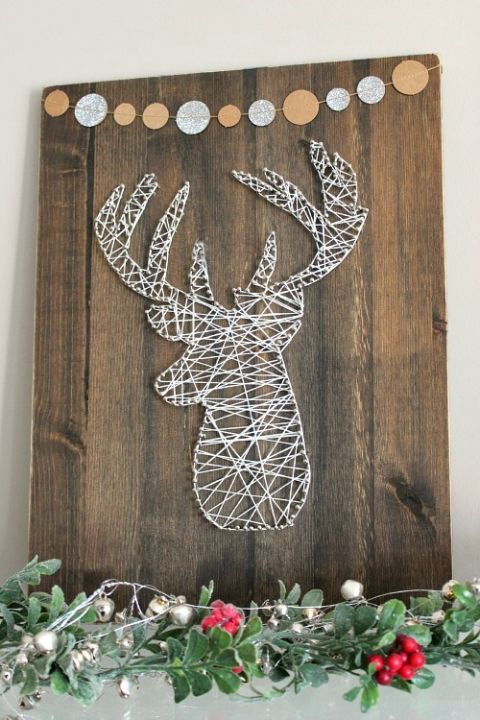 recycled wooden sign with a banner and a yarn and nail deer