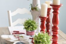 09 red and white tablescape with candles, fresh greenery and cranberries