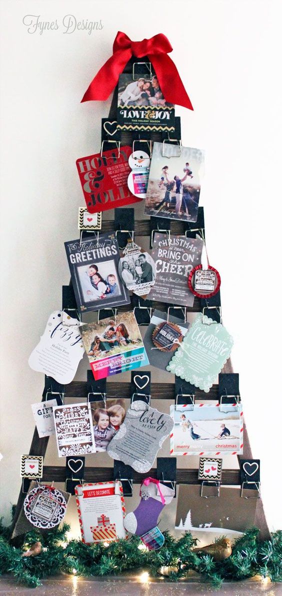 Tree shaped wooden frame with cards on it