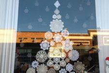 10 paper snowflakes attached to the window