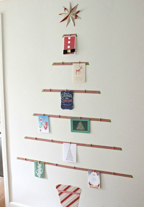 Tree shaped card display on the wall is a great idea to sort them all