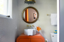11 There’s also a separate kids’ bathroom with bold furniture