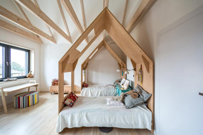 Wooden beams and light wood on the floor make the room cozier