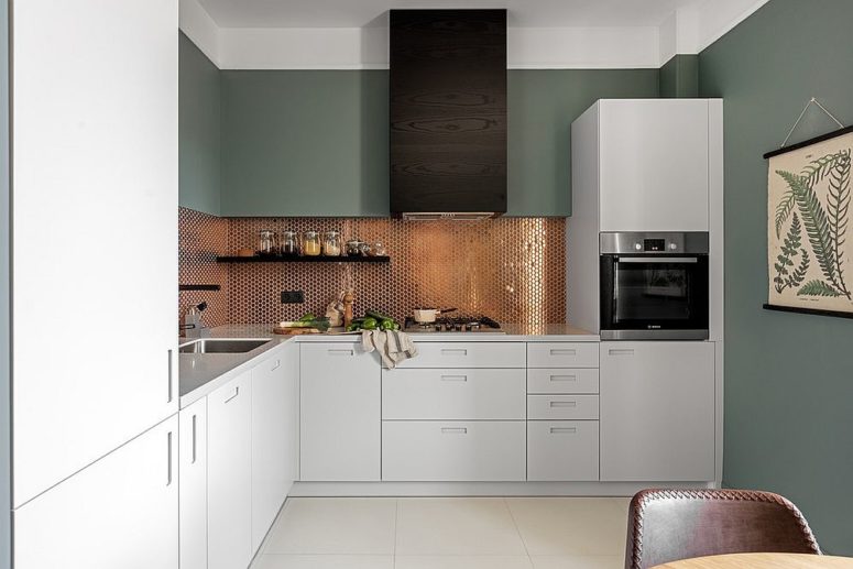 sleek contemporary kitchen with a sparkling copper penny tile backsplash