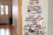 11 tree-shaped Christmas card display on the wall