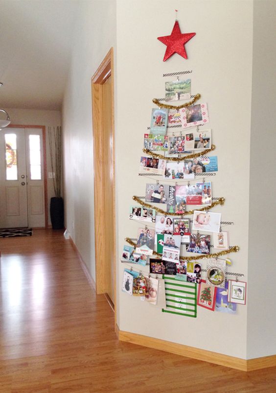 tree-shaped Christmas card display on the wall