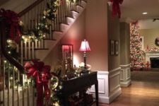 12 evergreen garland with red bows and lights