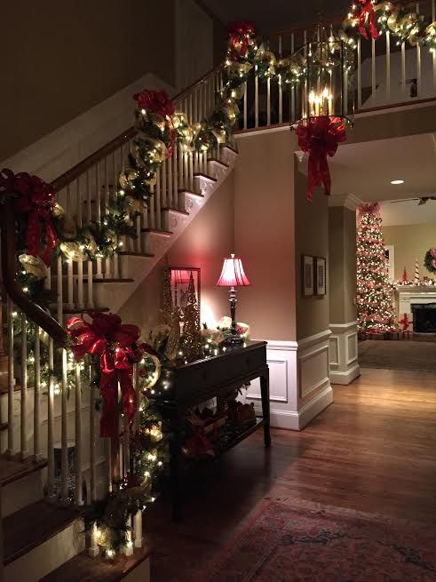 evergreen garland with red bows and lights