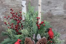 12 winter urn arrangement with pinecones, red berries and cardinals
