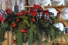 13 cute chandelier with plaid ribbon bows, fir branches and red jungle bells
